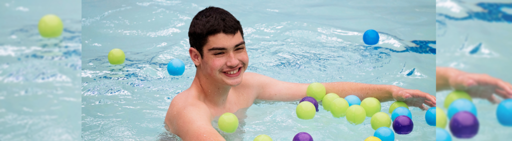 Photo of a participant with disabilities in a pool